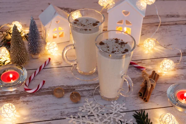 Fresh eggnog with cinnamon and nutmeg for christmas holiday. — Stock Photo, Image