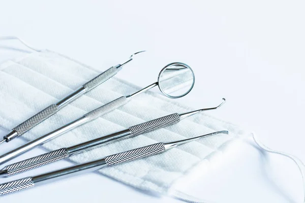 Dentistry tools for teeth dental care and treatment on white background. Professional dental instruments.