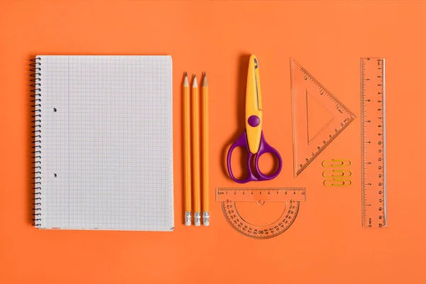 Blank Notebook School Office Supplies Orange Background Top View Back — Stock Photo, Image