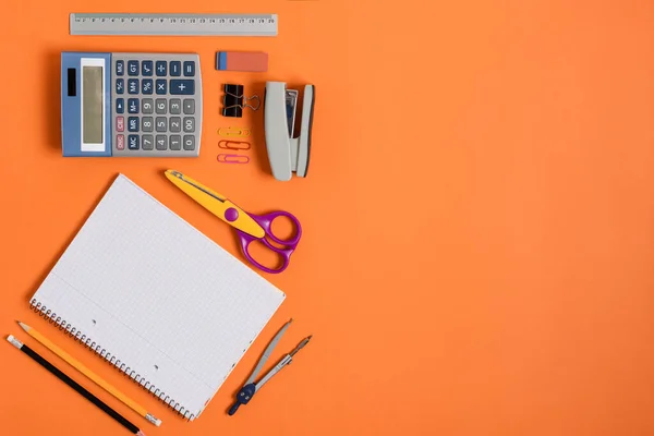 Blank Notebook School Office Supplies Orange Background Top View Back — Stock Photo, Image