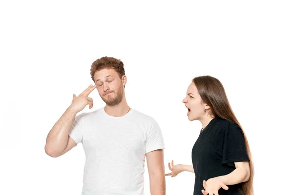 Studio shot of a couple quarreling. Angry woman shouting at the partner — Stock Photo, Image