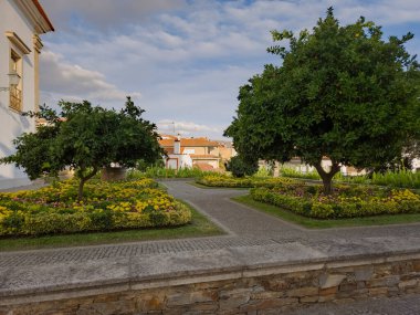 Garden in Mirandela, Portugal. Decorative flower beds, lush trees, and paved paths create a tranquil urban haven known as the garden city of the Tua Valley.