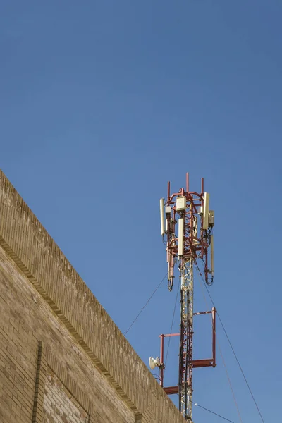 Cellular antenna. Communication on a building roof top
