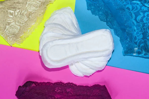 Sanitary pads and female panties. Medicine, women health and ovulation concept. Copy space — Stock Photo, Image