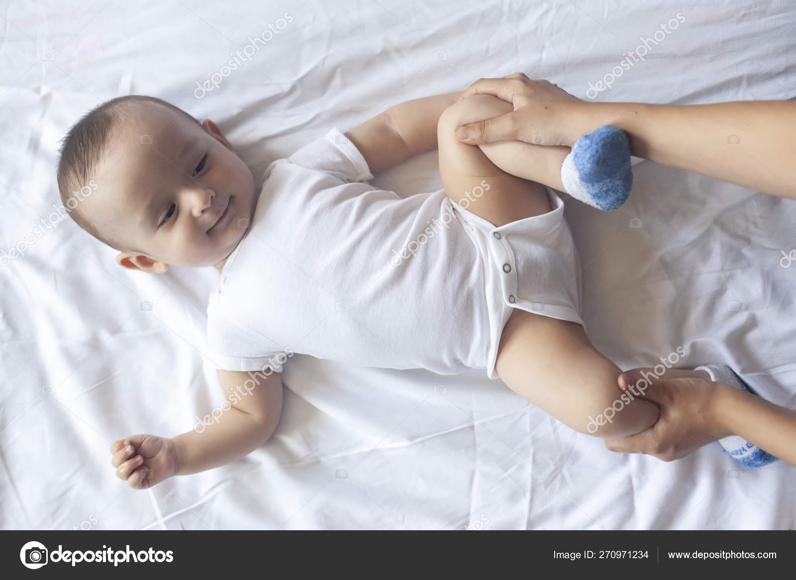 Baby Massage Mom Doing Gymnastics With Kid Mommy Massaging Cute Baby Boy Moving Baby S Legs To Help Relieve Constipation Young Mother Doing Exercises And Movements To Stimulate Baby S Bowels Stock Photo By C