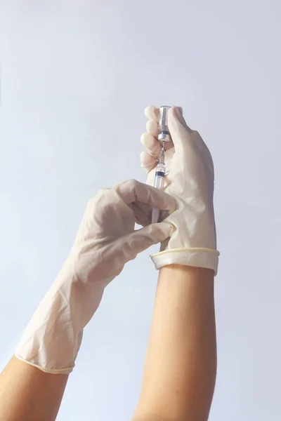 A nurse hands in glove with syringe and medicine. Medical, immunization and vaccination concept. — Stock Photo, Image