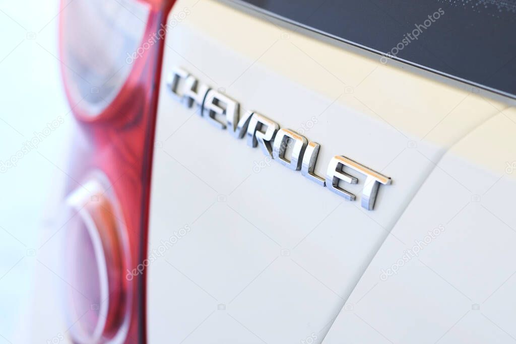 Tashkent, Uzbekistan - 20 May, 2020: Chevrolet logo on the back side of white Spark car