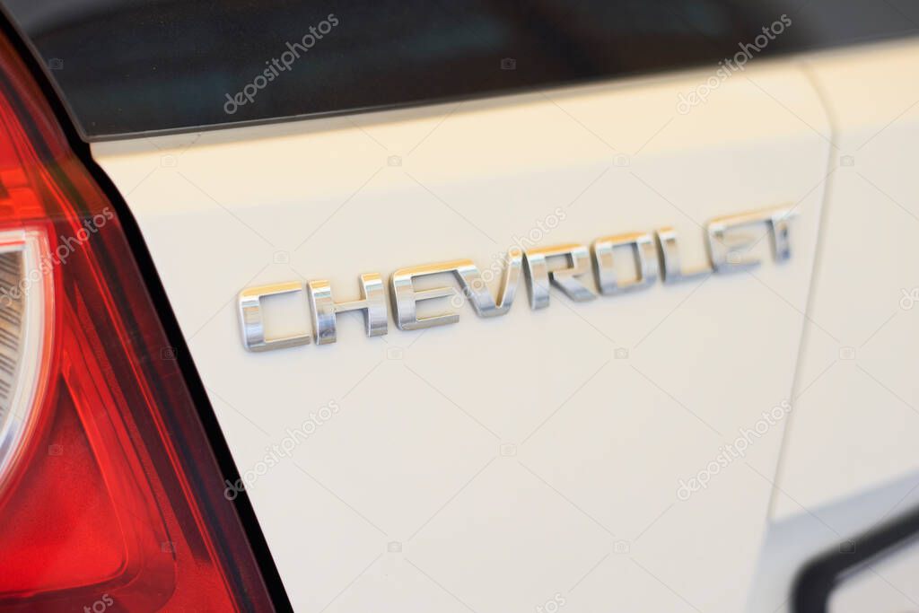 Tashkent, Uzbekistan - 20 May, 2020: Chevrolet logo on the back side of white Spark car