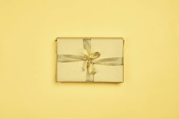 Christmas present box on yellow background