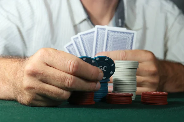 Gambler pays with chips — Stock Photo, Image