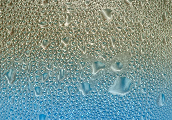 Textuur van abstracte blauwe en gouden water druppels — Stockfoto