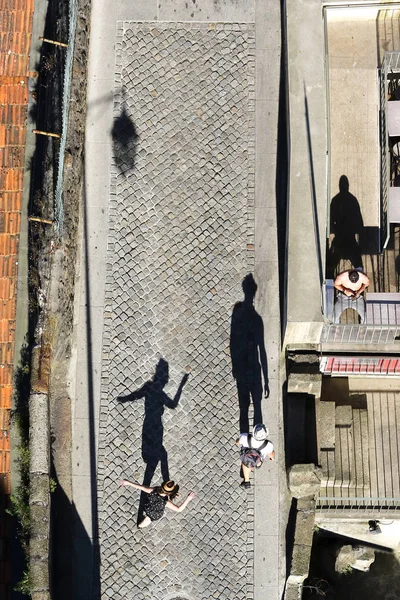 Top view of dancing boy and girl on the street in Porto