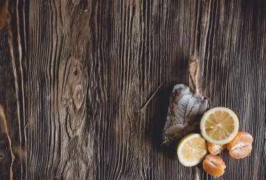 Different ripe citrus on wooden background