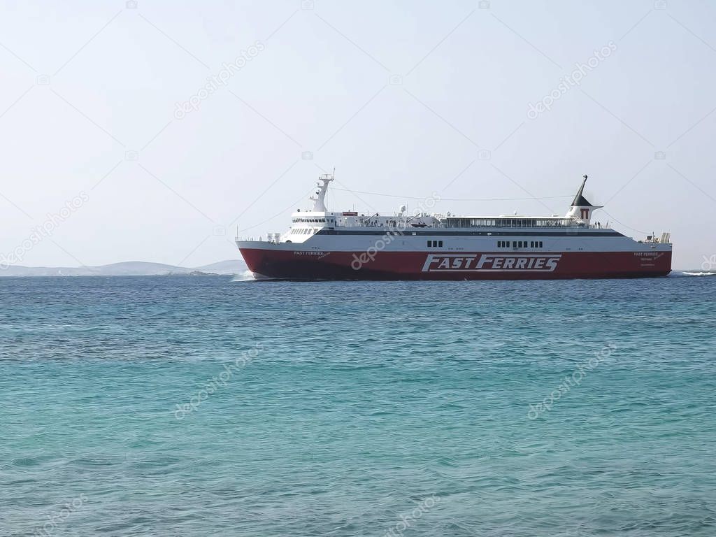 MYKONOS, GREECE- SEPTEMBER, 15, 2016: a ship from the fast ferries line arrives at mykonos