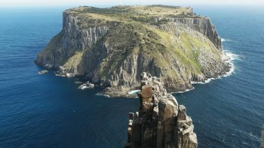 tasman island and the needle at cape pillar in tasmania clipart