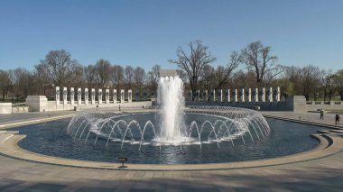 spring morning at the WWII memorial in washington clipart