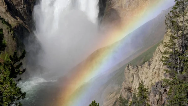 The base of lower yellowstone falls and a rainbow in yellowstone — Stock Photo, Image