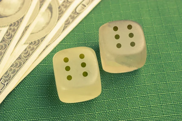 two dice with number six on each on green background