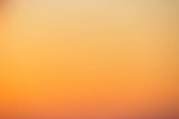 Yellow background concept: Sun light with blur beautiful nature autumn sunrise.