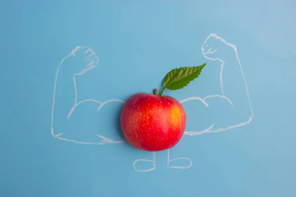 apple character with muscles. fitness and healthy eating concept
