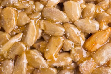 Ayçekirdeği şeker şurubu içinde bir gıda arka plan veya doku olarak yapılan Kozinaki.