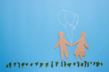 Erkek ve kadın mavi zemin üzerine siluetleri