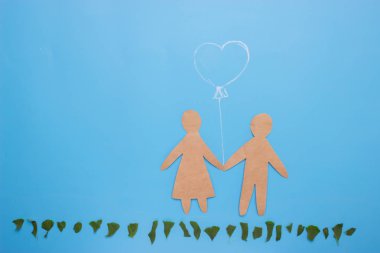 Erkek ve kadın mavi zemin üzerine siluetleri