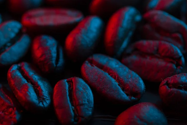 Roasted coffee bean close up in neon light