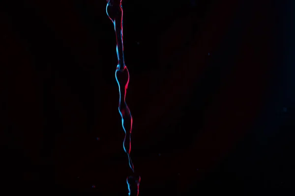 Roter Und Blauer Neon Hintergrund Aus Dem Wasserfluss Defokussiert — Stockfoto