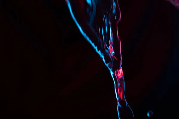 Roter Und Blauer Neon Hintergrund Aus Dem Wasserfluss Defokussiert — Stockfoto