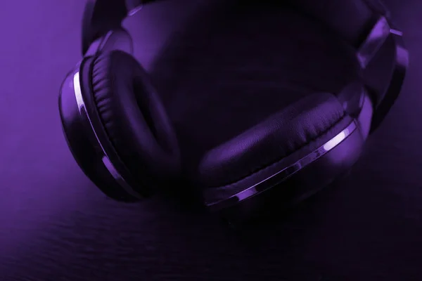 headphones on dark background in neon light