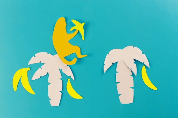 monkey on the beach with fruits. paper cut