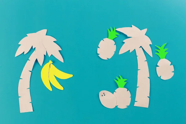 summer concept image. pineapples on blue background. paper cut