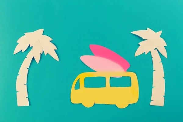 surf concept image, surfboards and palm trees. paper cut