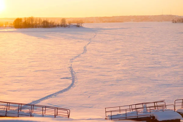 Winter sunset over field — 스톡 사진