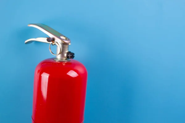 fire extinguisher on blue background