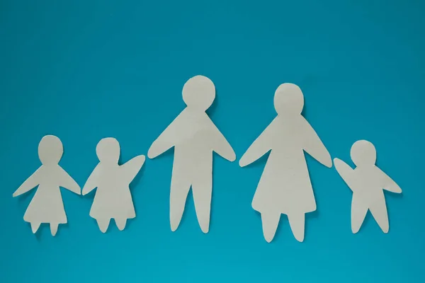 Paper family on blue background