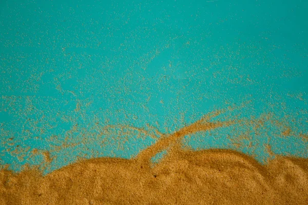 Sand on blue background — Stock Photo, Image