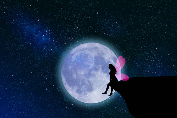 Silhouette of a woman sitting on a cliff. The moon is raising