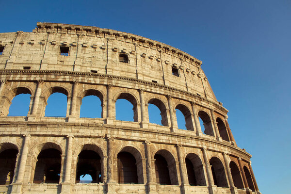 Bottom view of Colesseum with sky background in ancient Rome city