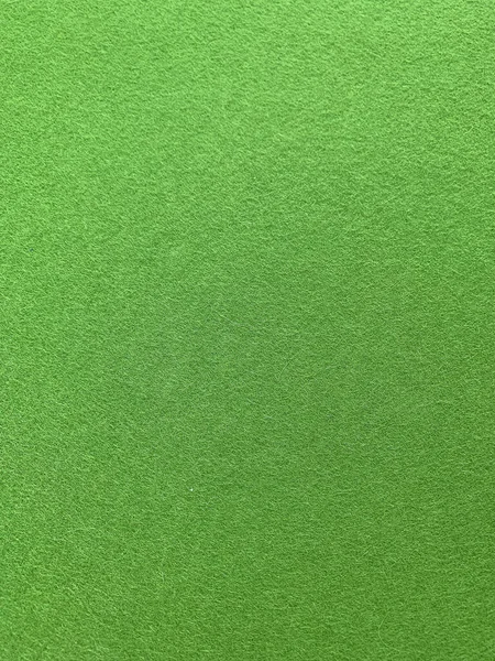 Yeşil keçeli kumaş arkaplanı görünümünü kapat.