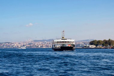 View of car ferry leaving from Sirkeci station. Asian side of Istanbul is in the background. It's a sunny summer day. clipart