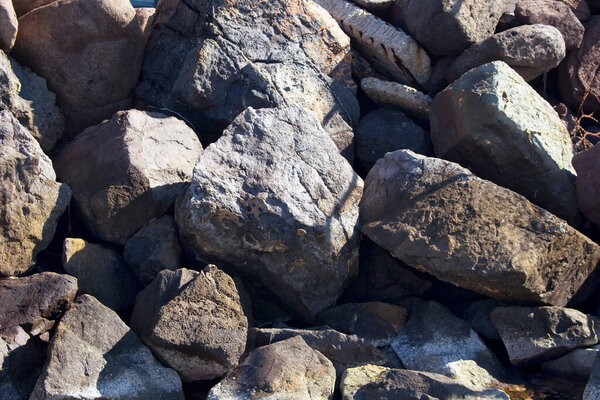 Top view of big, grey rocks (stones) at Aegean seashore in Bodrum city southwestern Turkey.