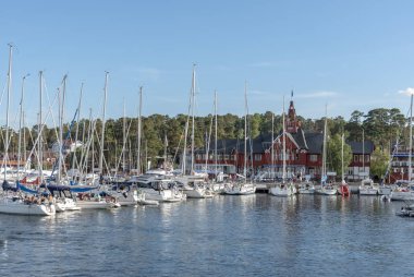 Sandhamn with sailboats in marina clipart