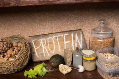 Protein, fındık, Hindistan cevizi yağı, avokado, soya, marul, fasulye tahin susam buğday sağlıklı gıda kavramı Vegan kaynakları