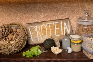 Protein, fındık, Hindistan cevizi yağı, avokado, soya, marul, fasulye tahin susam buğday sağlıklı gıda kavramı Vegan kaynakları