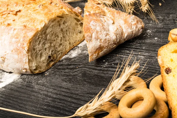 Wholegrain Bread from Whole Wheat, Rye and Flax Seeds, Wheat and Whole Wheat Biscuits with raisin and turmeric, olives, bagels