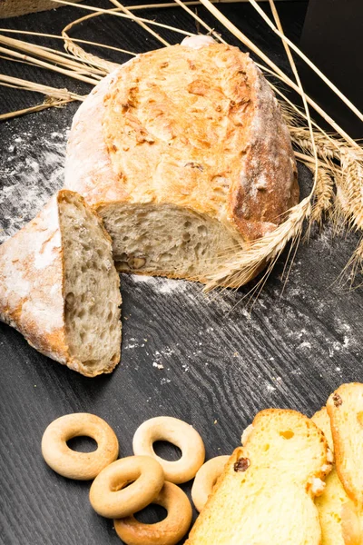 Wholegrain Bread from Whole Wheat, Rye and Flax Seeds, Wheat and Whole Wheat Biscuits with raisin and turmeric, olives, bagels