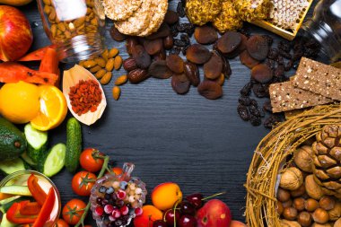 Sağlıklı gıda arka plan. Koleksiyonu farklı meyveler, meyveler ve Sebzeler Vejetaryen Sağlıklı atıştırmalıklar ile