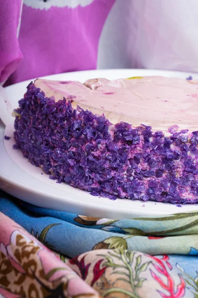 This is yummy purple yam cake on white plate, The root vegetable ,which has a sublime deep purple color ,makes the taste soft and sweet.
